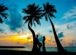 Romantic beach couple photo in Kerala honeymoon tour package by GT Holidays